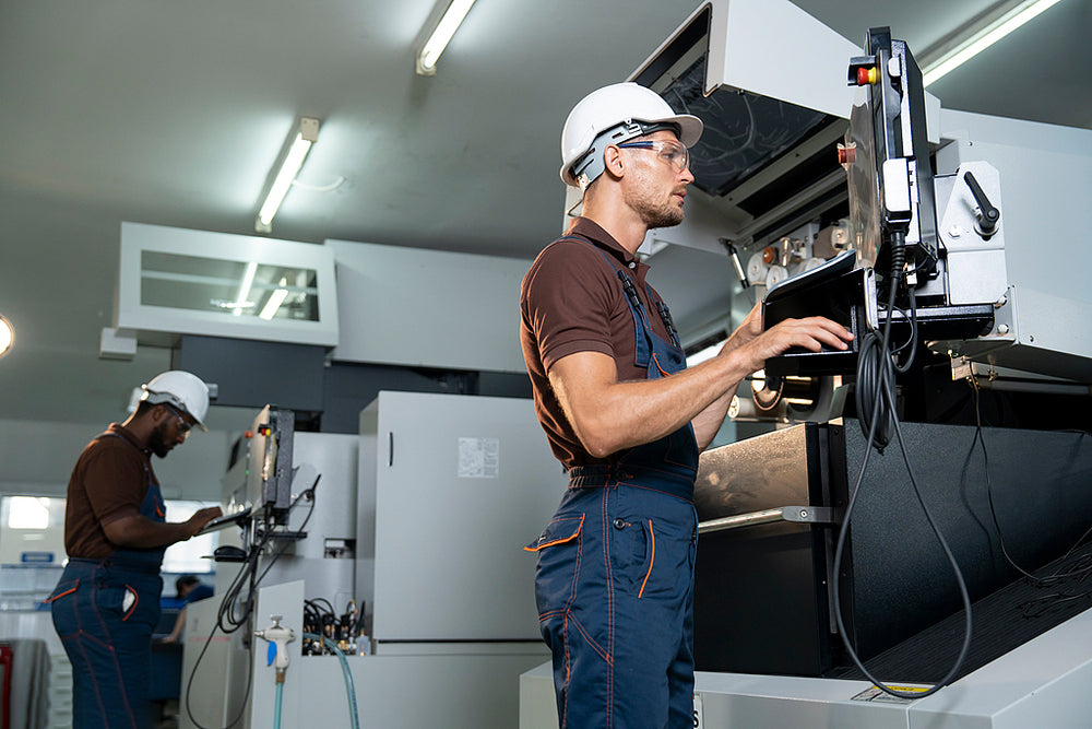 Quietlemon worker operating precision manufacturing equipment